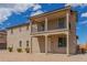 Charming two-story home with a balcony and low-maintenance landscaping at 820 E Agua Fria Ln, Avondale, AZ 85323