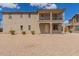 Charming two-story home with a balcony and low-maintenance landscaping at 820 E Agua Fria Ln, Avondale, AZ 85323