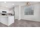 Bright kitchen features white cabinets, stainless steel appliances, and a convenient center island at 820 E Agua Fria Ln, Avondale, AZ 85323