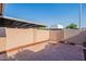 Enclosed backyard with mature trees offering shaded tranquility at 8309 E Rose Ln, Scottsdale, AZ 85250