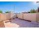 Private backyard with brick-paved patio and mature landscaping at 8309 E Rose Ln, Scottsdale, AZ 85250