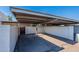 Carport with secure wooden gate for added privacy at 8309 E Rose Ln, Scottsdale, AZ 85250