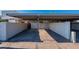 View of the carport featuring covered parking with painted brick surround at 8309 E Rose Ln, Scottsdale, AZ 85250