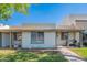 Inviting single-story home with well-maintained lawn, covered entry, and a peaceful residential setting at 8309 E Rose Ln, Scottsdale, AZ 85250