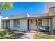 Charming single-story home with covered porch, desert landscaping, and inviting curb appeal at 8309 E Rose Ln, Scottsdale, AZ 85250