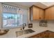 Bright and updated kitchen featuring stainless steel appliances and views to the back patio at 8309 E Rose Ln, Scottsdale, AZ 85250