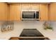 Close-up view of the kitchen appliances, countertops, and stylish decor elements at 8309 E Rose Ln, Scottsdale, AZ 85250