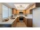 Updated kitchen featuring stainless steel appliances, stylish cabinetry, and ample counter space at 8309 E Rose Ln, Scottsdale, AZ 85250