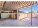 Covered patio features a privacy wall and brick pavers at 8309 E Rose Ln, Scottsdale, AZ 85250