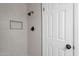 Tiled shower boasts a niche and modern fixtures for a spa-like experience at 8309 E Rose Ln, Scottsdale, AZ 85250