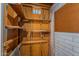 Unfinished storage area with open shelving ready for custom organization at 8309 E Rose Ln, Scottsdale, AZ 85250