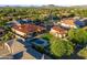 A beautiful house featuring a large pool and verdant landscaping at 8325 W Cantera Ave, Peoria, AZ 85383