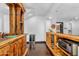 Bar area features a wooden bar and shelving, a wine fridge, and rustic accents at 8325 W Cantera Ave, Peoria, AZ 85383
