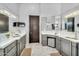 Elegant bathroom with double sinks, marble counters, and custom cabinets at 8325 W Cantera Ave, Peoria, AZ 85383