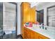 Bathroom with light wood cabinets, marble countertops, and separate bathtub and shower stall at 8325 W Cantera Ave, Peoria, AZ 85383