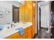 Bathroom vanity featuring wood cabinets, marble countertop and decorative accents at 8325 W Cantera Ave, Peoria, AZ 85383