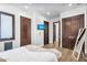 Comfortable bedroom featuring wood floors, media, and neutral paint at 8325 W Cantera Ave, Peoria, AZ 85383