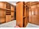 Spacious walk-in closet with custom shelving and drawers for ample storage at 8325 W Cantera Ave, Peoria, AZ 85383