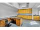 Flex space with plenty of storage, work space, and a large desk with granite countertops at 8325 W Cantera Ave, Peoria, AZ 85383