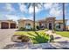 Charming home with well-maintained front yard, beautiful landscaping, and a brick driveway at 8325 W Cantera Ave, Peoria, AZ 85383