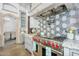 Gourmet kitchen features stainless steel appliances and granite countertops at 8325 W Cantera Ave, Peoria, AZ 85383