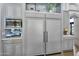 Kitchen featuring stainless steel appliances, custom cabinets, and built-in microwave at 8325 W Cantera Ave, Peoria, AZ 85383