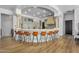 Gourmet kitchen with granite countertops, custom cabinetry, and a breakfast bar with seating for eight at 8325 W Cantera Ave, Peoria, AZ 85383