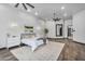 Bright main bedroom with wood floors, ceiling fan, and calming decor at 8325 W Cantera Ave, Peoria, AZ 85383