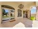 Outdoor patio featuring tile flooring, stone pillars, an outdoor grill, and a view of the backyard at 8325 W Cantera Ave, Peoria, AZ 85383