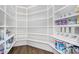Walk-in pantry with custom built-in shelving and ample storage space at 8325 W Cantera Ave, Peoria, AZ 85383