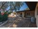 Relaxing back patio space with outdoor dining and low maintenance desert landscaping at 8540 N 43Rd Dr, Glendale, AZ 85302