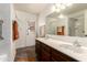 Bathroom features a double vanity, a large mirror, and a shower with glass doors at 8540 N 43Rd Dr, Glendale, AZ 85302