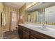 Bathroom with double sinks, vinyl floor, and traditional style at 8540 N 43Rd Dr, Glendale, AZ 85302