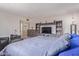 Comfortable bedroom with a spacious layout, featuring a large entertainment center and cozy seating, perfect for relaxation at 8540 N 43Rd Dr, Glendale, AZ 85302