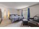 Spacious bedroom featuring two beds, comfortable seating, and stylish decor, creating a relaxing and inviting personal space at 8540 N 43Rd Dr, Glendale, AZ 85302