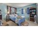 Bedroom with lots of natural light, blue walls, and queen bed at 8540 N 43Rd Dr, Glendale, AZ 85302