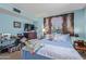 Bedroom with lots of natural light, blue walls, and queen bed at 8540 N 43Rd Dr, Glendale, AZ 85302