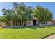 Charming single story home featuring mature trees, a lawn, and a convenient attached two car garage at 8540 N 43Rd Dr, Glendale, AZ 85302