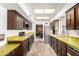 Bright kitchen with wood-look floors, unique cabinetry, and stainless steel appliances at 8540 N 43Rd Dr, Glendale, AZ 85302