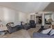 Relaxing living room featuring sofas, an entertainment center, and neutral decor at 8540 N 43Rd Dr, Glendale, AZ 85302