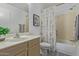 Bathroom featuring a shower-tub combo, single sink vanity, and a neutral color scheme for a functional space at 8569 W Voltaire Ave, Peoria, AZ 85381
