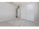 Bedroom featuring soft carpet, light walls, closet, and ample space for furniture arrangements at 8569 W Voltaire Ave, Peoria, AZ 85381