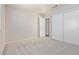 Spacious bedroom with soft carpet, light walls, closet, and ample space for furniture arrangements at 8569 W Voltaire Ave, Peoria, AZ 85381