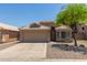 Charming single-story home with a two-car garage and well-maintained landscaping at 8569 W Voltaire Ave, Peoria, AZ 85381