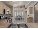 Well-lit kitchen with stainless steel appliances and a view of the adjacent breakfast nook at 8569 W Voltaire Ave, Peoria, AZ 85381