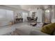 Open floor plan with a view of the dining area, showcasing modern decor and ample natural light at 8569 W Voltaire Ave, Peoria, AZ 85381