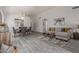A well staged living area with light gray walls and modern decor and furniture at 8569 W Voltaire Ave, Peoria, AZ 85381