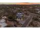 Sweeping aerial view captures the neighborhood setting, the elegant desert home, and private pool at 9301 E Via Montoya --, Scottsdale, AZ 85255