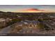 Stunning aerial view of a luxury home with desert landscaping, circular driveway, and mountain views at 9301 E Via Montoya --, Scottsdale, AZ 85255