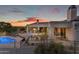 Expansive backyard boasts a large pool, diverse outdoor living spaces, and secure perimeter fencing at 9301 E Via Montoya --, Scottsdale, AZ 85255